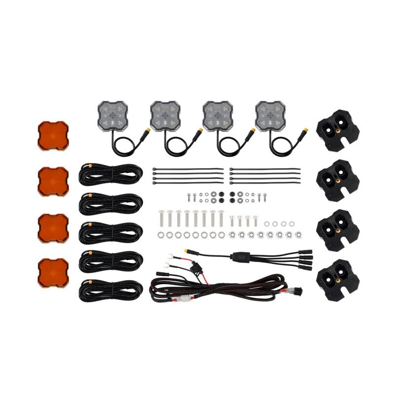 Diode Dynamics Stage Series dual-color Red/White LED rock lights with angled mounting brackets for Kuat IBEX Bed Rack.