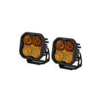 Pair of Diode Dynamics SS3 Max 3-inch LED pods with yellow combo optics and amber backlight.