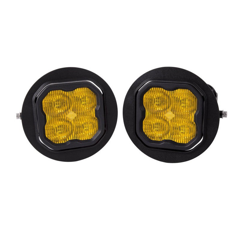 Diode Dynamics SS3 Pro yellow 3-inch LED pod fog light kit with round mounting brackets and wiring adapters.