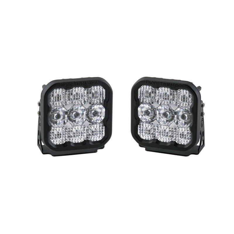 A pair of 5-inch Diode Dynamics SS5 Sport LED pods showing the multi-lens white combo optics and black aluminum housings.