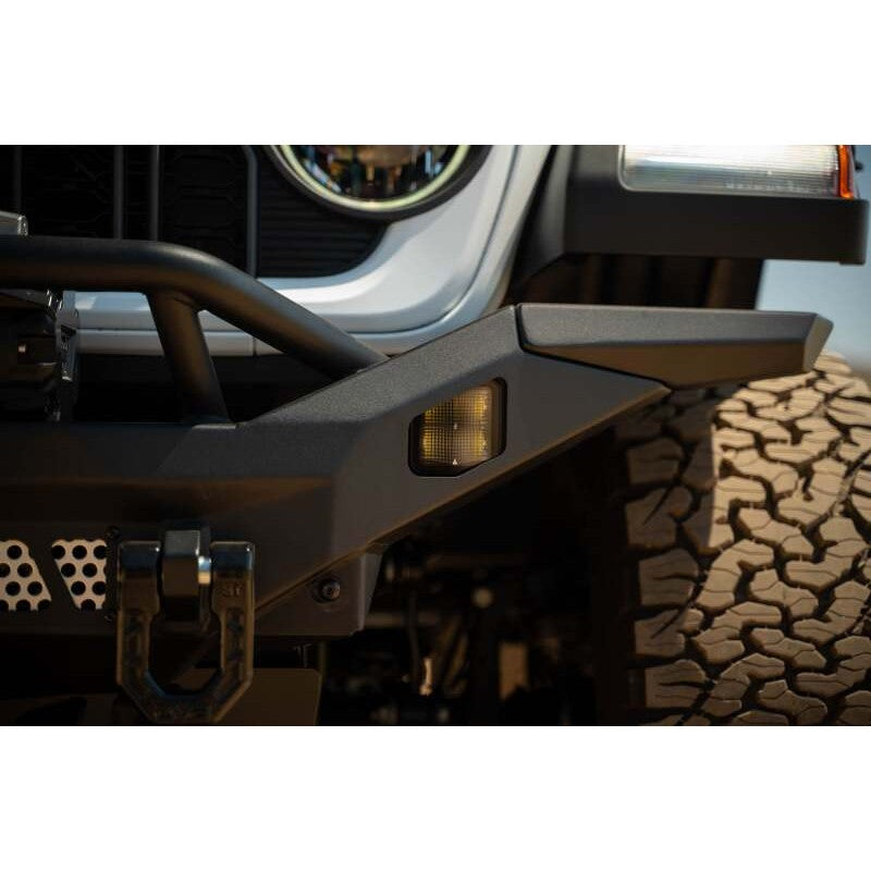 DV8 Offroad MTO Series micro-texture black full-width winch front bumper with bull bar for 2007-2025 Jeep Wrangler.