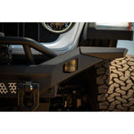 DV8 Offroad MTO Series micro-texture black full-width winch front bumper with bull bar for 2007-2025 Jeep Wrangler.