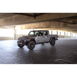 DV8 Offroad FS-1 Series black stubby front bumper with bull bar and recessed winch tray for Jeep Wrangler JK and JL.