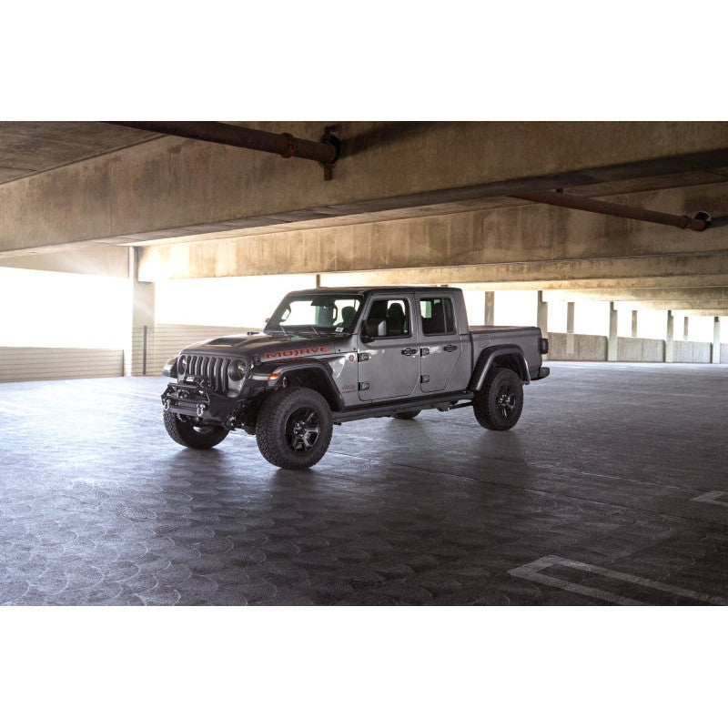 DV8 Offroad FS-1 Series black stubby front bumper with bull bar and recessed winch tray for Jeep Wrangler JK and JL.