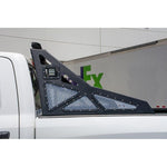 DV8 Offroad black powder-coated bolt-on chase rack with aluminum mesh inserts for 2010-2018 Ram trucks.