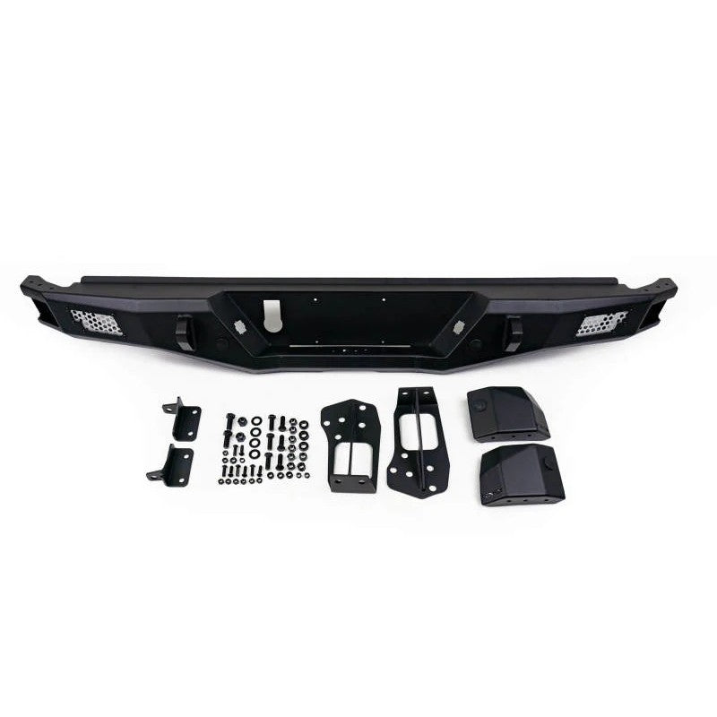 DV8 Offroad MTO Series micro-texture black rear bumper with side steps and mesh inserts for 2016-2023 Toyota Tacoma.