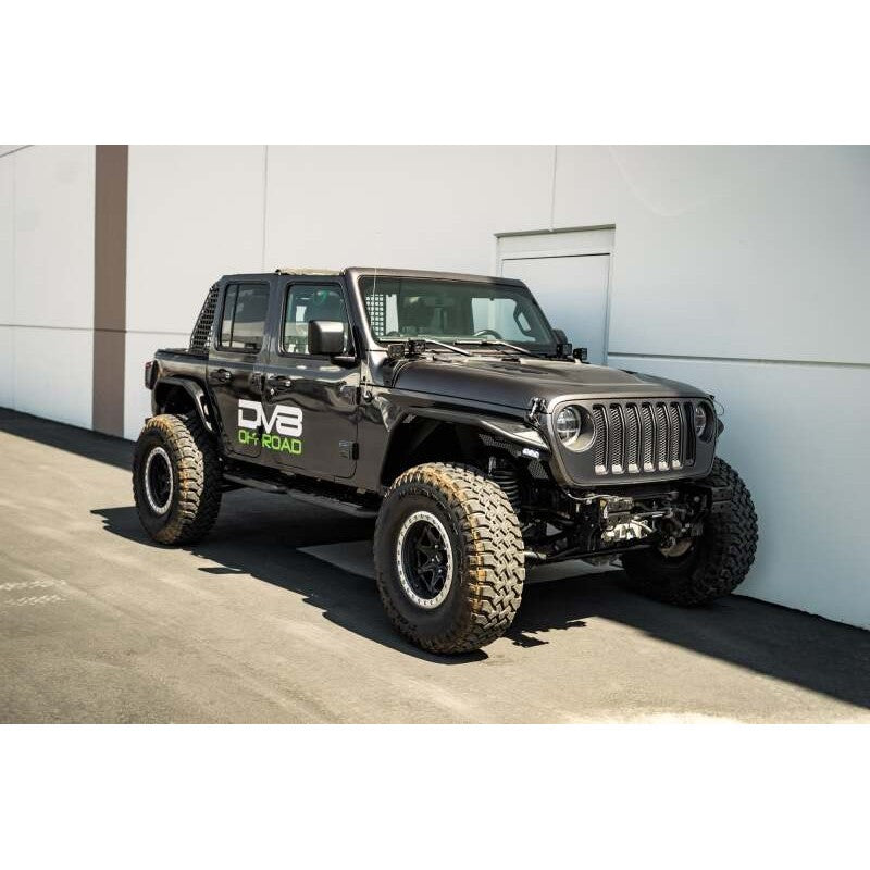 DV8 Offroad micro-texture black OE Plus side steps mounted to the pinch weld of a Jeep Wrangler JL 4-door