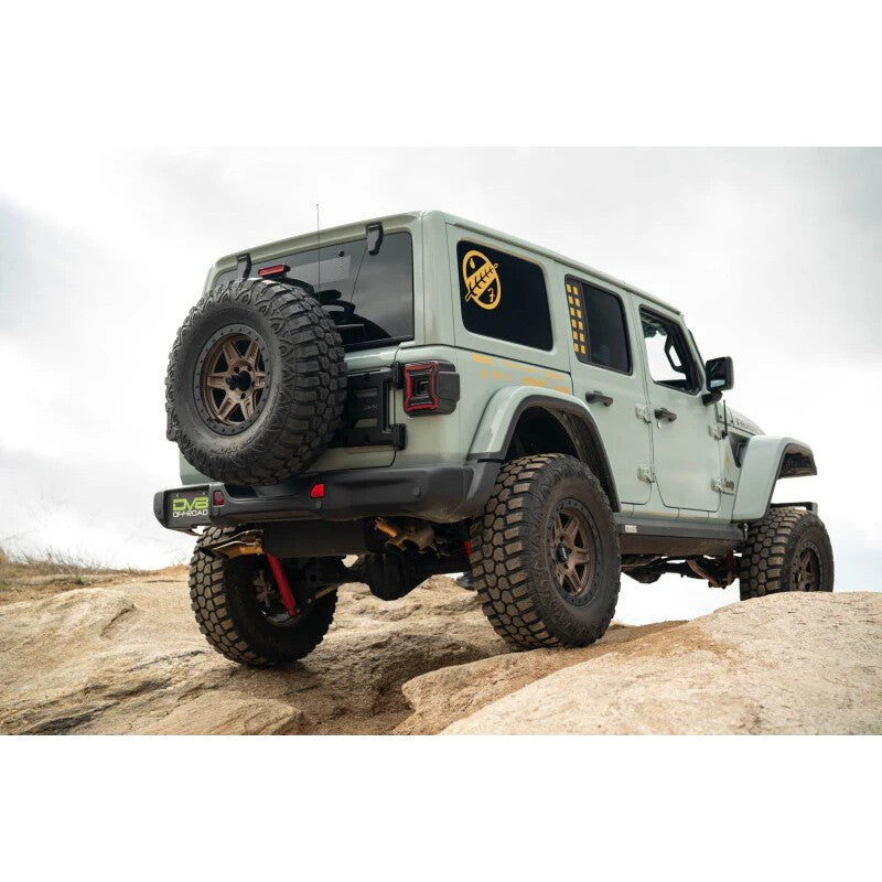 DV8 Offroad TCJL-15 heavy-duty spare tire carrier installed on a Jeep Wrangler JL tailgate