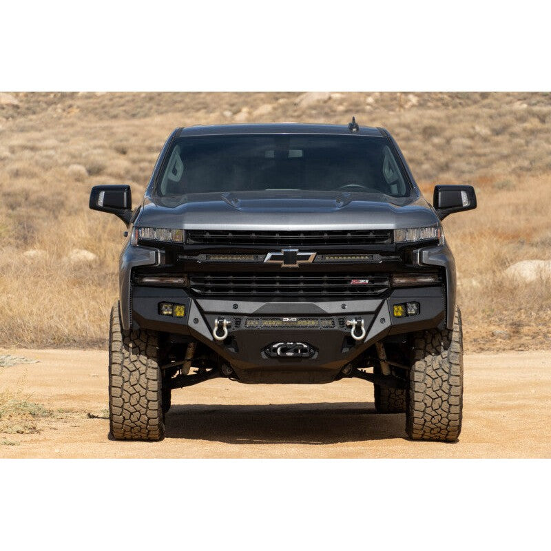 DV8 Offroad SPEC Series micro-texture black front winch bumper with sensor cutouts for 2019-2021 Silverado 1500.