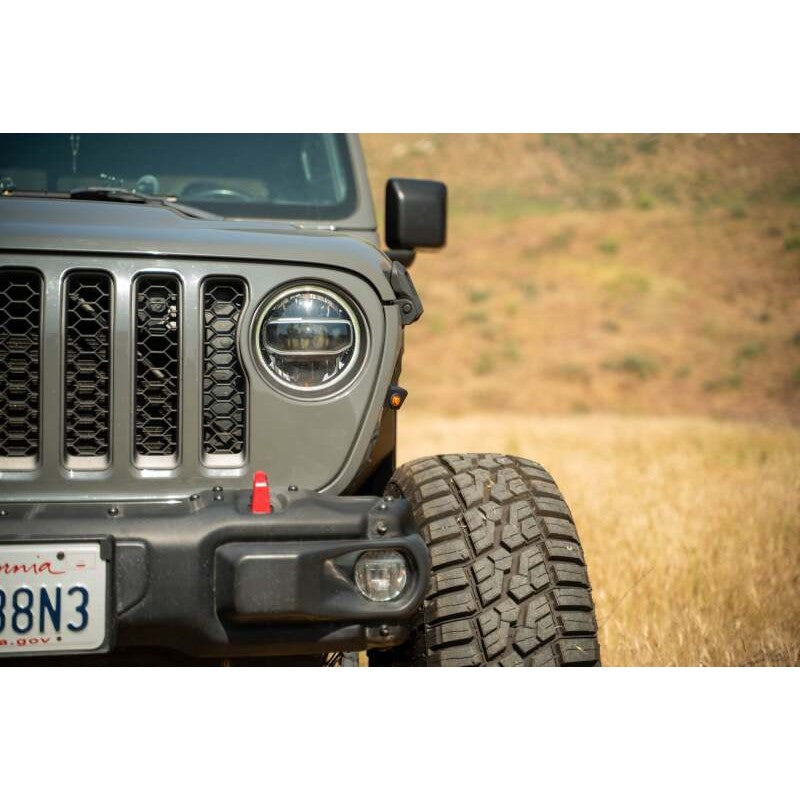 Black steel DV8 Offroad fender deletes with amber LED turn signals installed on a Jeep Gladiator JT.