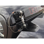 Black billet aluminum DV8 Offroad hood hold downs with stainless steel helm joints and tethered quick-release pins.