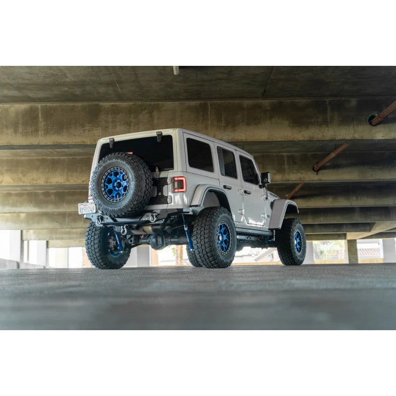 DV8 Offroad FS-15 high-clearance rear bumper with micro-texture black powder coat on a Jeep Wrangler JL.