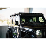 DV8 Offroad black micro-texture powder coated 50 inch light bar bracket mounted on a Jeep Wrangler windshield pillar