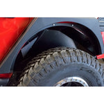 DV8 Offroad black powder-coated aluminum rear inner fender liners for Jeep Wrangler JL.