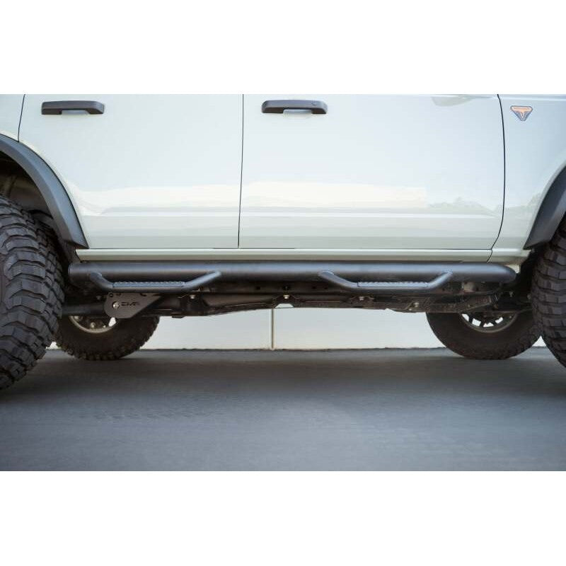 DV8 Offroad black micro-texture powder coated steel trailing arm skid plates for 2021-2026 Ford Bronco.