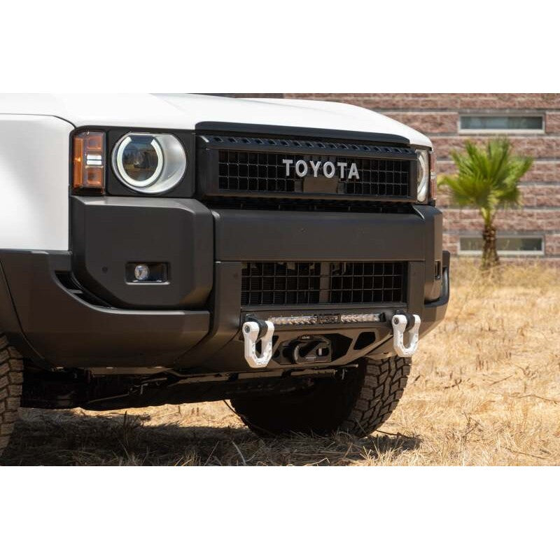 DV8 Offroad Centric micro-texture black front bumper with winch mount for 2024-2026 Toyota Land Cruiser