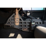Black 3.5mm steel center console Molle panels and device mount installed in a 2024 Toyota Tacoma interior.