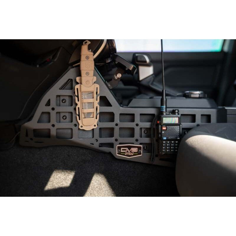 Black 3.5mm steel center console Molle panels and device mount installed in a 2024 Toyota Tacoma interior.