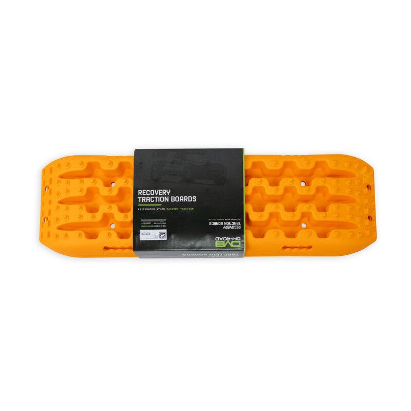A pair of orange DV8 Offroad DV8 Xtract traction boards with high-traction surface, molded handles, and shovel ends.