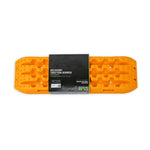 A pair of orange DV8 Offroad DV8 Xtract traction boards with high-traction surface, molded handles, and shovel ends.
