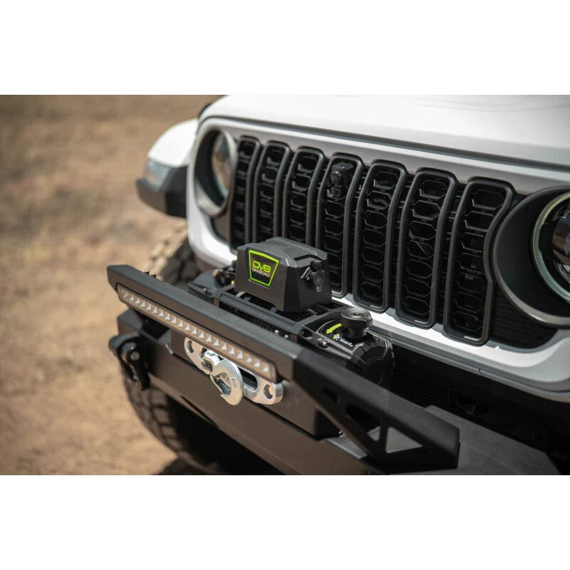DV8 Xtract WB12K-SR 12,000 lb winch with black aluminum housing, synthetic rope, and silver aluminum hawse fairlead.