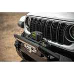 DV8 Xtract WB12K-SR 12,000 lb winch with black aluminum housing, synthetic rope, and silver aluminum hawse fairlead.