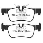 EBC Brakes Ultimax2 rear brake pads with shims, slots, and chamfers for BMW and Mini fitment.