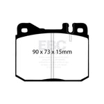 Set of EBC Brakes Ultimax2 front brake pads featuring shims, slots, and chamfered edges for Mercedes-Benz.
