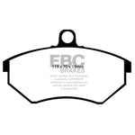 Black EBC Ultimax2 front brake pads featuring center slots, chamfered edges, and pre-installed noise-reducing shims.