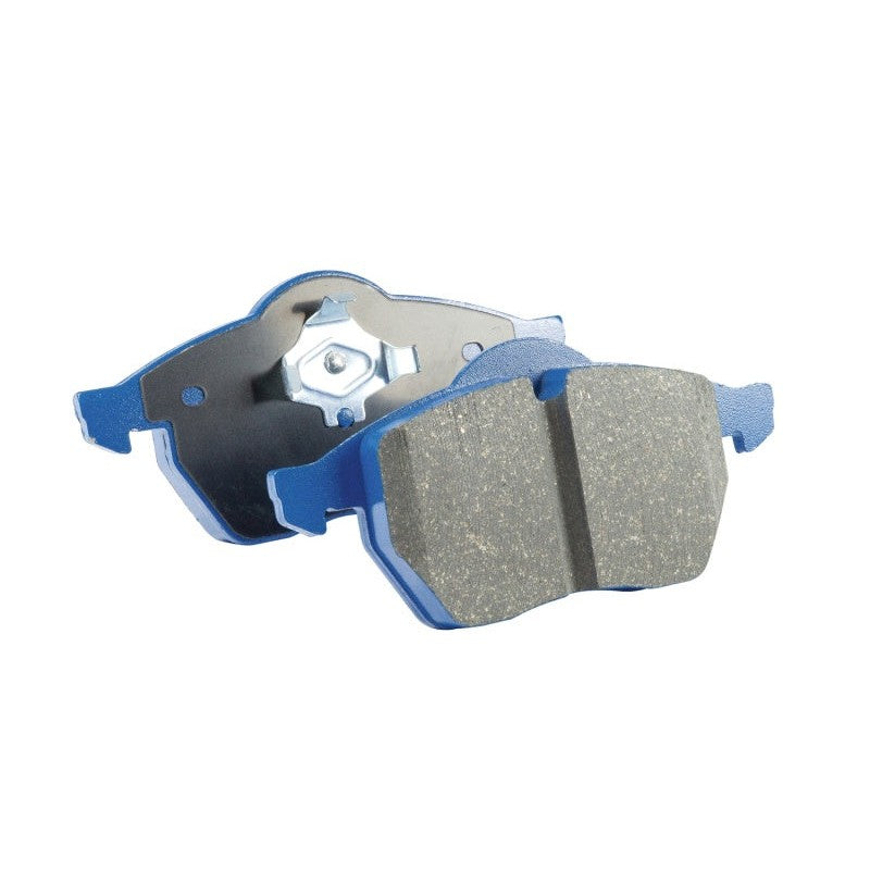 EBC Bluestuff NDX front brake pads with deep V-grooves and blue high-friction material.
