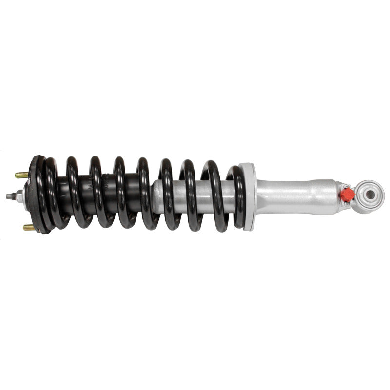 Rancho RS999907 quickLIFT Loaded front left strut assembly with silver coil spring and adjustable RS9000XL damping knob.