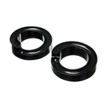 A pair of black Energy Suspension Hyper-Flex polyurethane front coil spring isolators for 2005-2007 Ford Super Duty trucks.