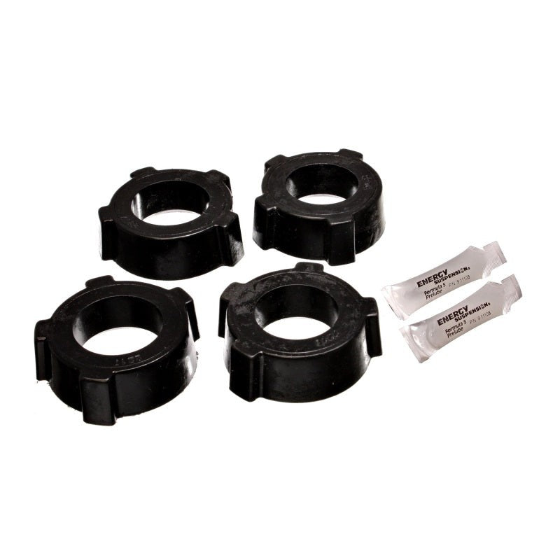 Black polyurethane rear spring plate bushings for 1954-1968 Volkswagen Beetle swing axle suspension.