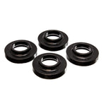 Set of four black Energy Suspension Hyper-Flex polyurethane coil spring lift isolators for Jeep vehicles.