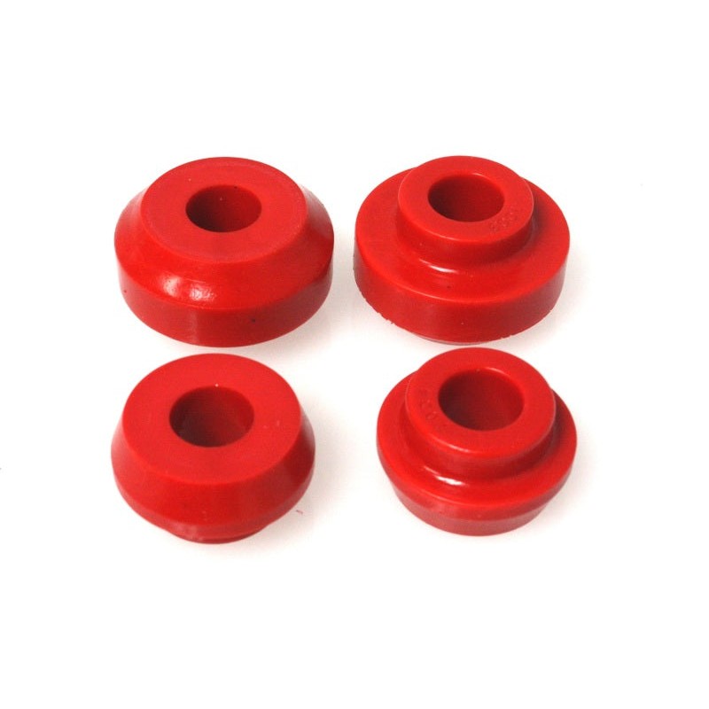 Red Energy Suspension Hyper-Flex polyurethane strut arm bushings with included metal sleeves and hardware.