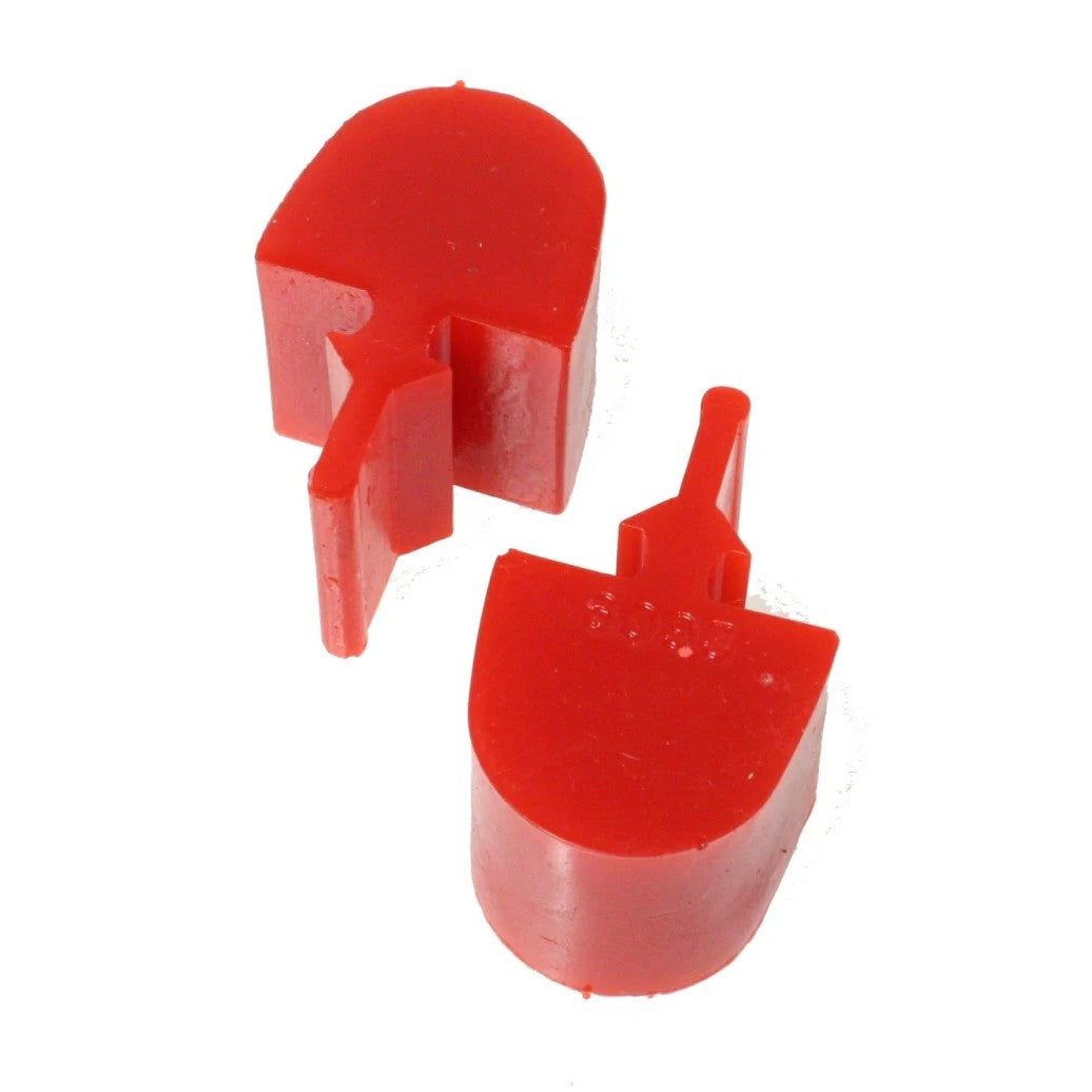 A pair of Energy Suspension red polyurethane pull-thru style suspension bump stops with a pointed snubber design.