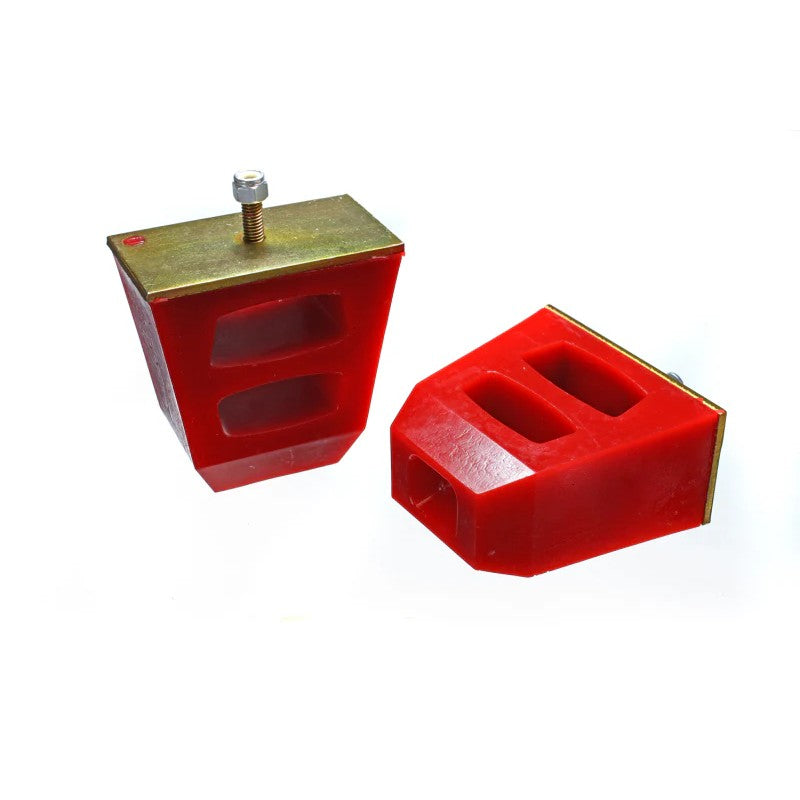 Pair of red Energy Suspension universal polyurethane bump stops showing the integrated metal mounting plates.