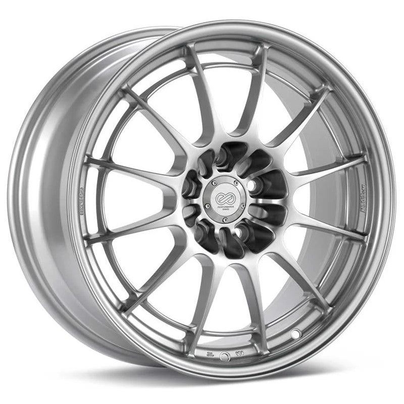 Enkei NT03+M 18x8.5 silver wheel with multi-spoke design and signature perimeter reinforcement ring.