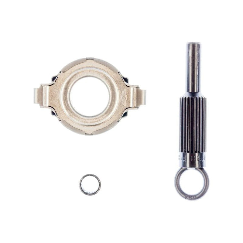 Exedy MZAK102 clutch accessory kit featuring a release bearing, pilot bearing, and plastic alignment tool.