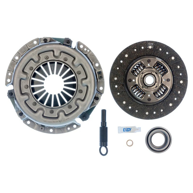 Exedy NSK1004 OE replacement clutch kit showing the pressure plate, clutch disc, release bearing, and alignment tool.
