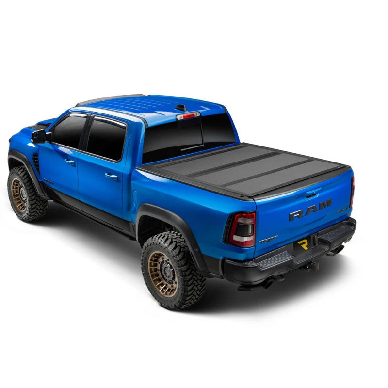 Extang Endure ALX matte black low-profile hard folding truck bed cover on a 2024-2026 Toyota Tacoma 5ft bed
