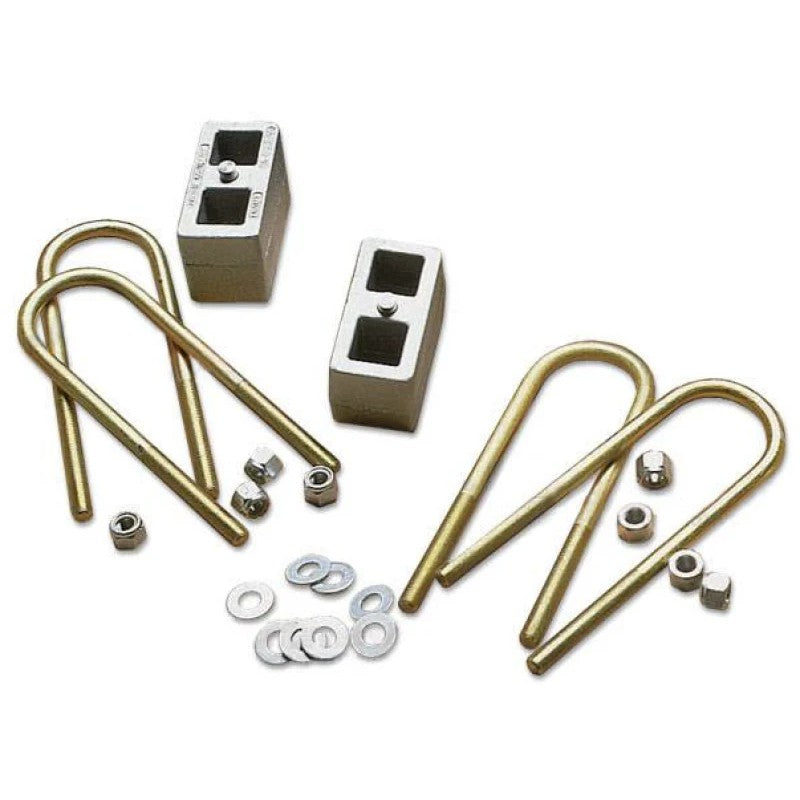 Fabtech 4-inch rear lift box kit featuring 5-inch lift blocks and bump stop relocation brackets for Ford Super Duty.