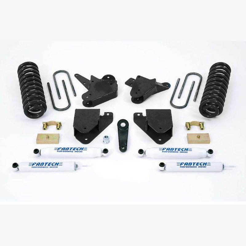 Fabtech 6-inch suspension lift kit featuring coil springs, Performance Shocks, drop pitman arm, and heavy-duty brackets.