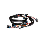 FAST XFI fuel injector wiring harness with black protective loom and multi-pin automotive connectors.