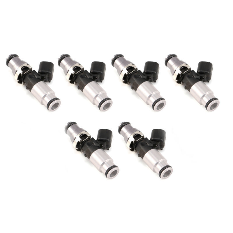 Set of six Injector Dynamics ID1300X fuel injectors with grey 14mm tops and silver bottoms for VR6 12V engines.