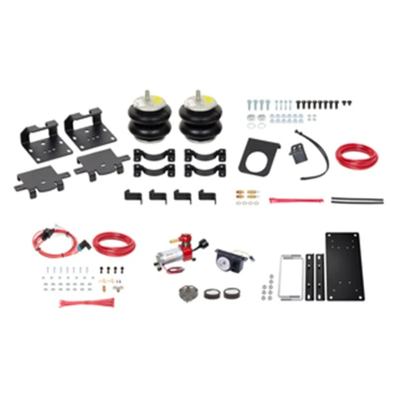 Firestone Ride-Rite All-In-One air spring kit including airbags, analog compressor, back-lit gauge, and mounting hardware.