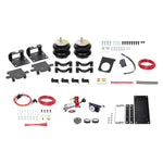 Firestone Ride-Rite All-In-One air spring kit including airbags, analog compressor, back-lit gauge, and mounting hardware.