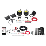 Firestone Ride-Rite air springs with wireless compressor, no-drill mounting plate, and hardware for Silverado 1500.
