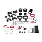 Firestone Ride-Rite All-In-One air helper spring kit with air bellows, analog gauge, compressor, and mounting hardware.