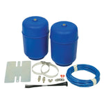 Pair of red Firestone Coil-Rite polyurethane air helper springs with air line and inflation valves.